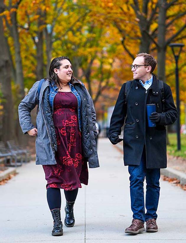 Two employees walking on Biogen campus