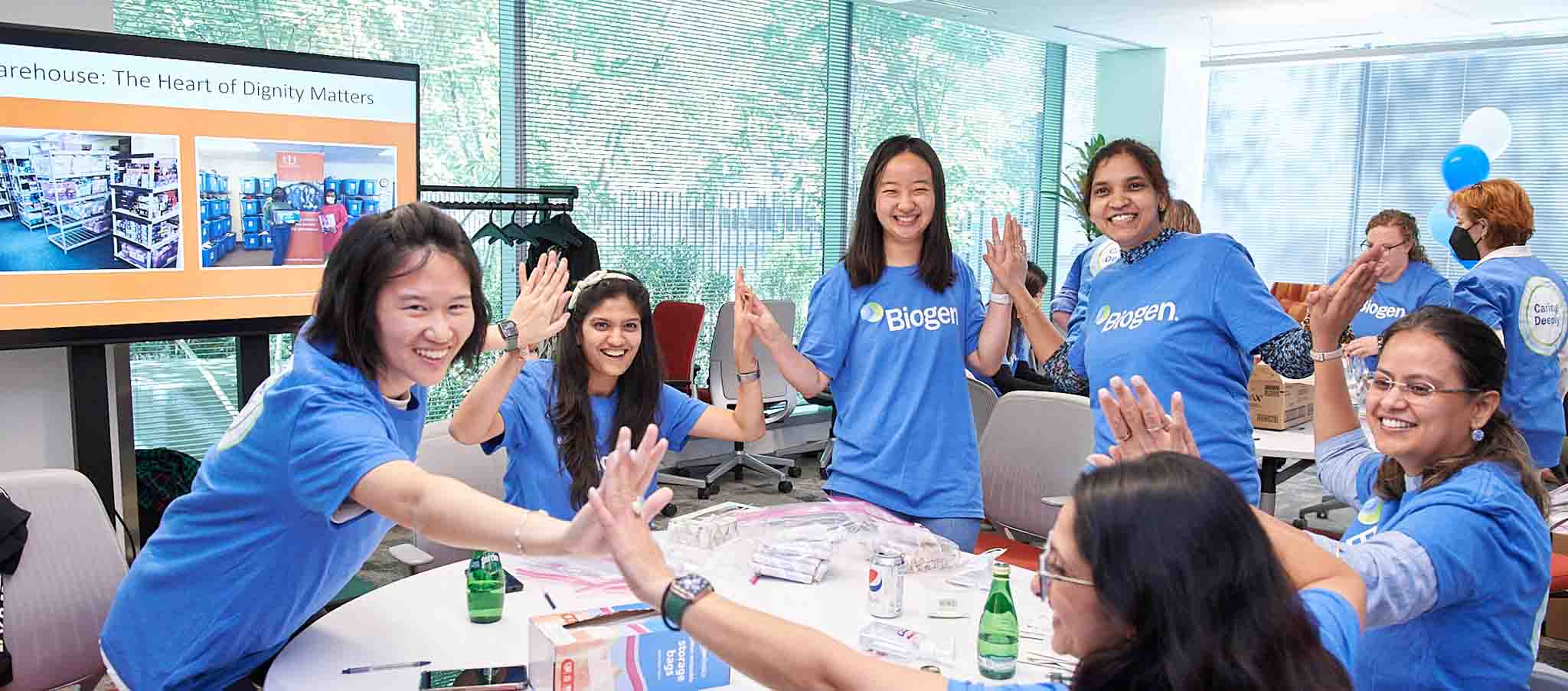 Biogen employees volunteering to sort food for the nonprofit Food For Free