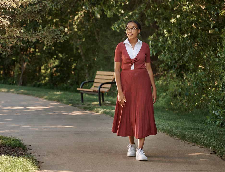 Lauren, living with MS, walking through a park