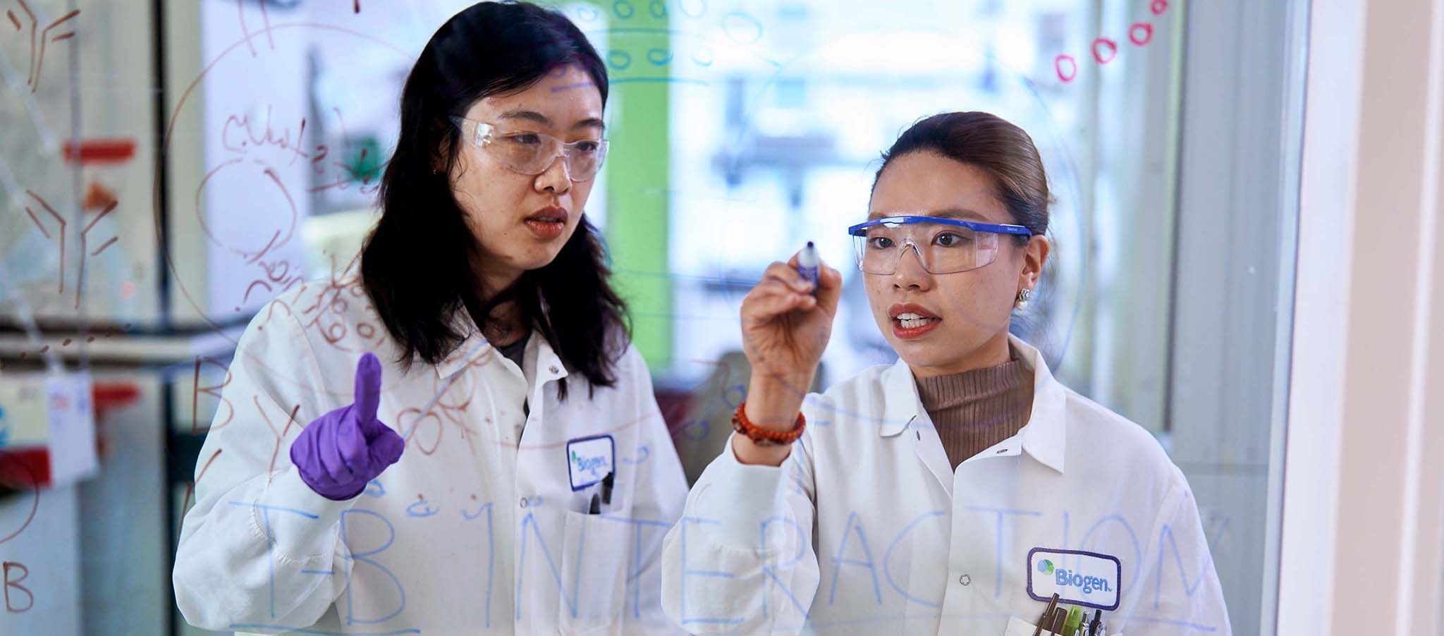two Biogen scientists