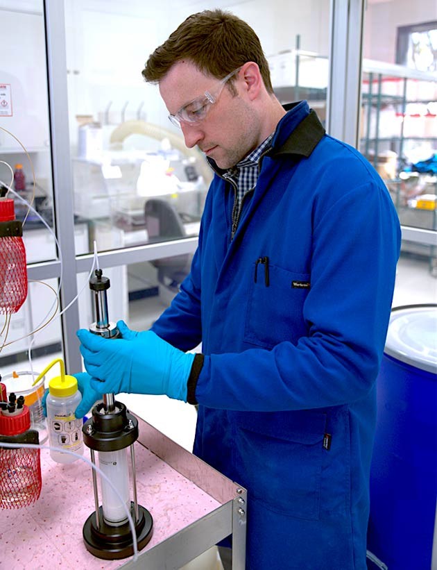 Thomas Pickel, senior scientist packing a column with resin.