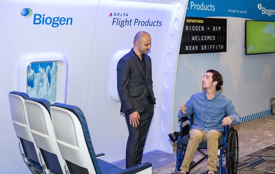 Delta employee with man in wheelchair