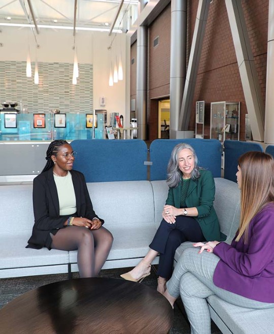 Three women employees at Biogen