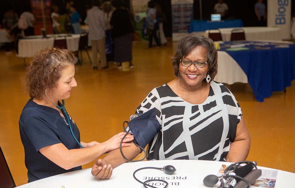 woman having her blood pressure taken