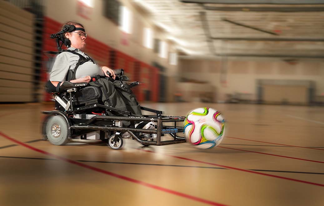 Nathan going after a soccer ball in gym