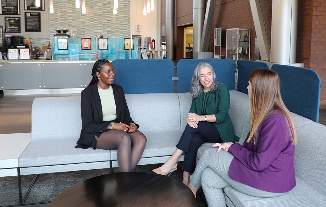 Three employees at Biogen meeting together