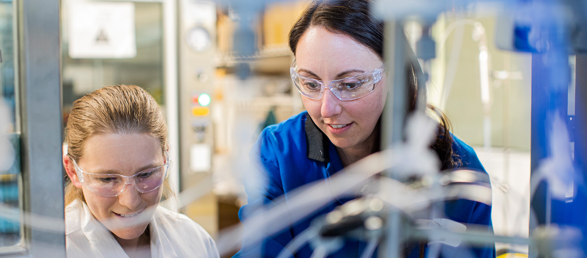 Two women working together in a lab setting