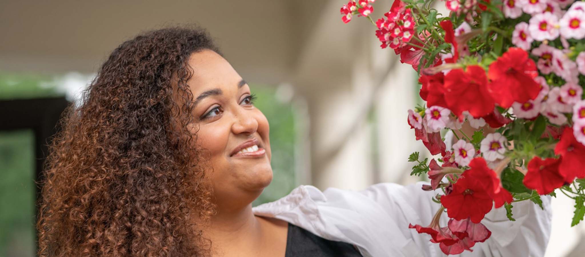 Jada admiring flowers