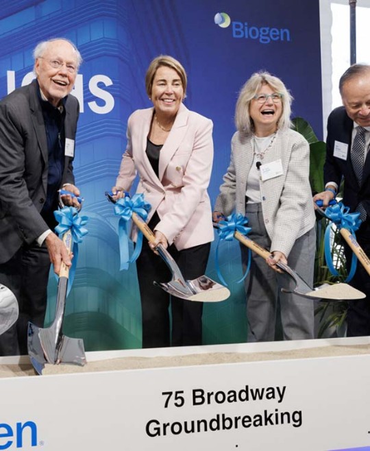 Group with shovels celebrating the breaking ground of the new building